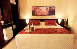 Cama ou camas em um quarto em Bogari Hotel
