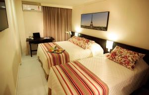 Cama ou camas em um quarto em Bogari Hotel