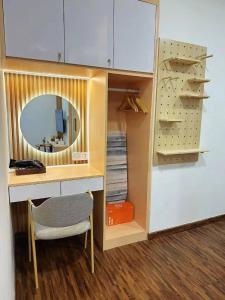 a desk with a mirror and a chair in a room at K Avenue Seaview Nearby Kota Kinabalu Airport Free Car Park & Water Filter in Kota Kinabalu