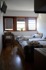 Ein Bett oder Betten in einem Zimmer der Unterkunft Hotel Celjska Koca