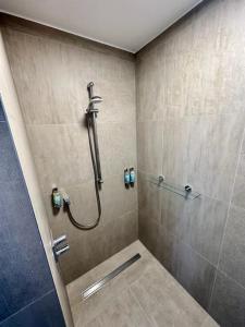 a shower stall in a bathroom with a shower at Ferienhaus - EMILY in Burhave +26 photos