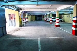 an empty parking lot in a parking garage at Residence Blue Sky in Douala