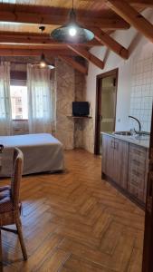 Posteľ alebo postele v izbe v ubytovaní Apartamentos Rurales La Platea