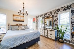 a bedroom with a bed and a large mirror at Kalani Retreat in Tauranga