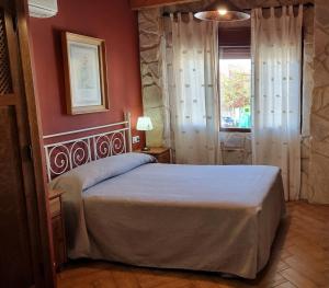 Posteľ alebo postele v izbe v ubytovaní Apartamentos Rurales La Platea