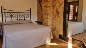 Posteľ alebo postele v izbe v ubytovaní Apartamentos Rurales La Platea