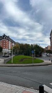 a roundabout with a park in the middle of a street at Naia´s Living T3 in Bilbao