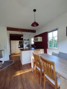 a kitchen with a large wooden table and chairs at Ferienhaus Schlossbauer in Spielberg