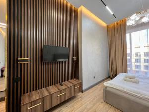 Ένα ή περισσότερα κρεβάτια σε δωμάτιο στο Стильные апартаменты в элитном комплексе