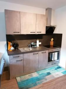 a kitchen with a sink and a stove at Zirlerhof in Weerberg