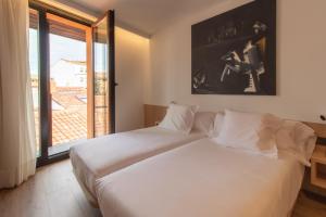 Postel nebo postele na pokoji v ubytování Hotel Cortabitarte
