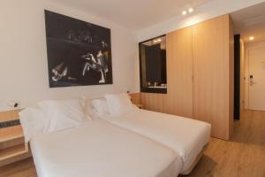 Postel nebo postele na pokoji v ubytování Hotel Cortabitarte