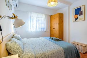 Łóżko lub łóżka w pokoju w obiekcie Inftour Apolo Apartamento