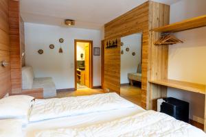 Ένα ή περισσότερα κρεβάτια σε δωμάτιο στο Hotel Dahu