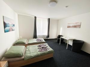 Postel nebo postele na pokoji v ubytování Apartmány Plzeň Zborovská 22 a
