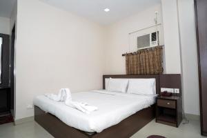 Postel nebo postele na pokoji v ubytování Sonar Bangla Guest House