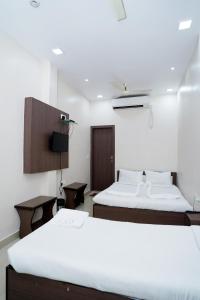 Postel nebo postele na pokoji v ubytování Sonar Bangla Guest House