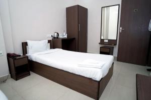 Postel nebo postele na pokoji v ubytování Sonar Bangla Guest House