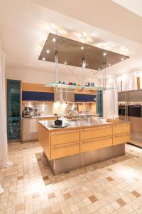 a large kitchen with a sink and a counter at Set of Flats Vol 1 2 3 in Tríkala