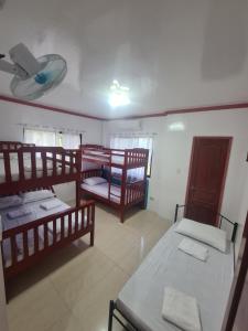 Postel nebo postele na pokoji v ubytování Rotunda Inn home stay