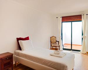 Llit o llits en una habitació de FLH Tavira Family Duplex Apartment