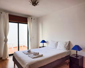 Llit o llits en una habitació de FLH Tavira Family Duplex Apartment