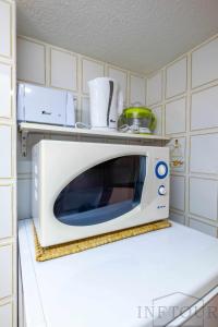 Kuchnia lub aneks kuchenny w obiekcie Inftour Apolo Apartamento