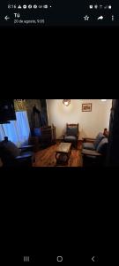 a living room with two couches and a table at LAS GRINGAS in Mar del Sur