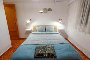 Łóżko lub łóżka w pokoju w obiekcie Inftour Apolo Apartamento