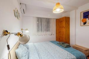 Łóżko lub łóżka w pokoju w obiekcie Inftour Apolo Apartamento