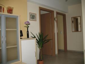 a room with a door and a vase with flowers in it at Haus Klara in Detzem