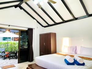 Ліжко або ліжка в номері Boomerang Village Resort Kata