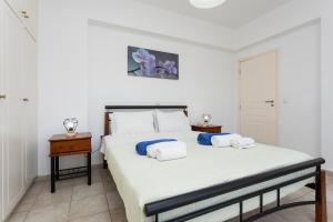 Postel nebo postele na pokoji v ubytování Hermione Villa