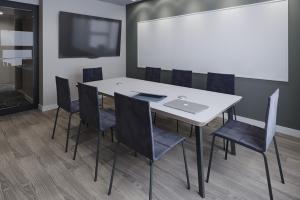 a conference room with a white table and chairs at Central Sq 2br w Doorman nr Charles River BOS-951 in Cambridge