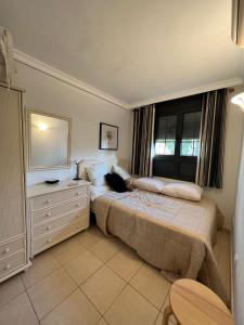 a bedroom with a black cat sitting on a bed at Cosy three bedroom bungalow in Costa Adeje in Adeje
