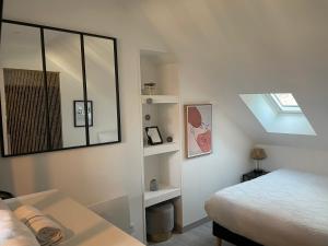 Posteľ alebo postele v izbe v ubytovaní Magnifique logement au pied du Château