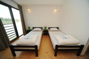 Letto o letti in una camera di B&B Botel Charlie