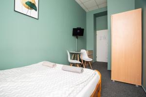 Posteľ alebo postele v izbe v ubytovaní Moon Hostel Wrocław