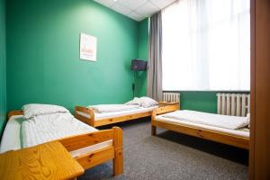 Posteľ alebo postele v izbe v ubytovaní Moon Hostel Wrocław