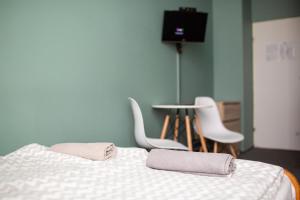 Posteľ alebo postele v izbe v ubytovaní Moon Hostel Wrocław