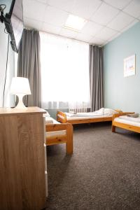 Posteľ alebo postele v izbe v ubytovaní Moon Hostel Wrocław