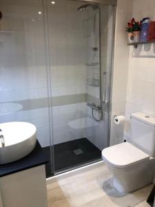 a bathroom with a shower and a toilet and a sink at Family Place, Next to Ski Lift & Mountain view! in Alp