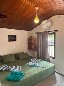 a bedroom with a large bed and a window at Sabine Holiday Resort and Restaurant in Matara