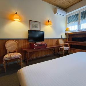 TV a/nebo společenská místnost v ubytování Hotel Miramonti