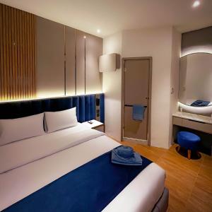 Postel nebo postele na pokoji v ubytování Qube Hotel by 98hospitality