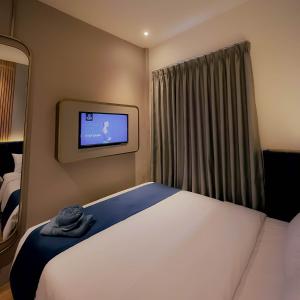 Posteľ alebo postele v izbe v ubytovaní Qube Hotel by 98hospitality