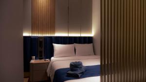 Posteľ alebo postele v izbe v ubytovaní Qube Hotel by 98hospitality