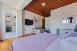 Posteľ alebo postele v izbe v ubytovaní Perica apartment and Perica room with separate entrance
