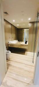a bathroom with a toilet and a tub and a sink at One bedroom apartment - DAMAC TOWER in Riyadh