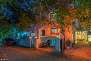 a house is lit up at night at Zostel Pune (Viman Nagar) in Pune